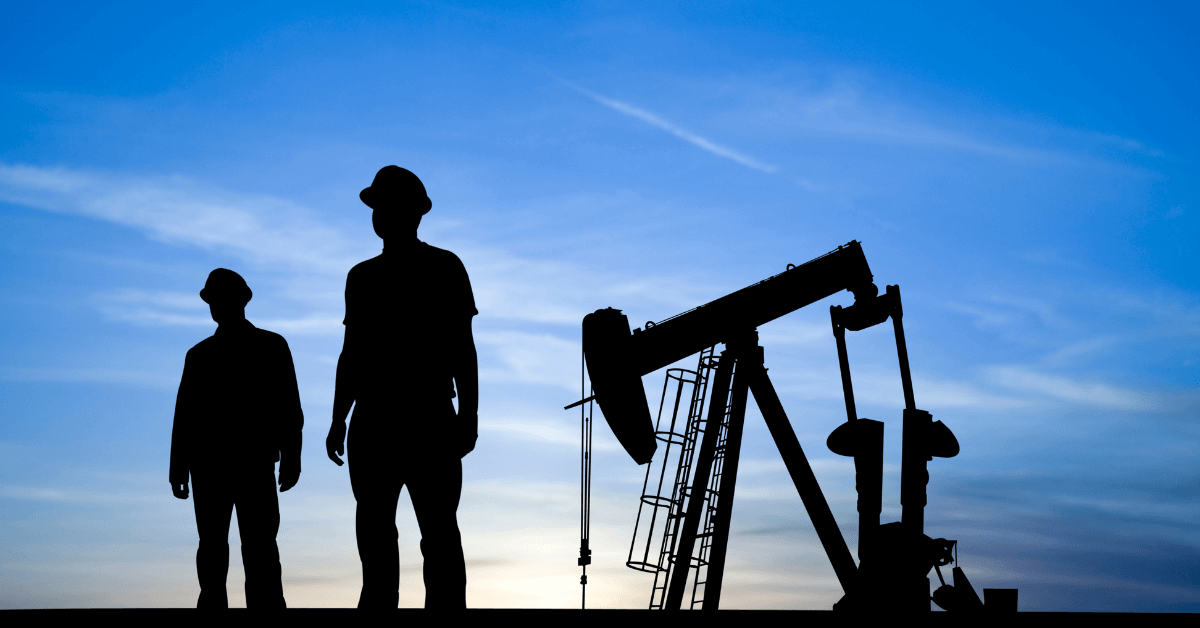 two oil and gas field engineers on the job site for oil and gas accounting