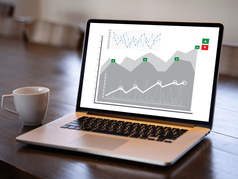 A laptop showing positive and negative chart values