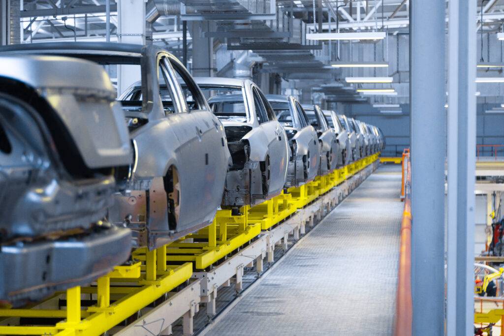 Modern automobile production line, automated production equipment. Shop for the Assembly of new modern cars. The way of Assembly of the car on the Assembly line at the plant