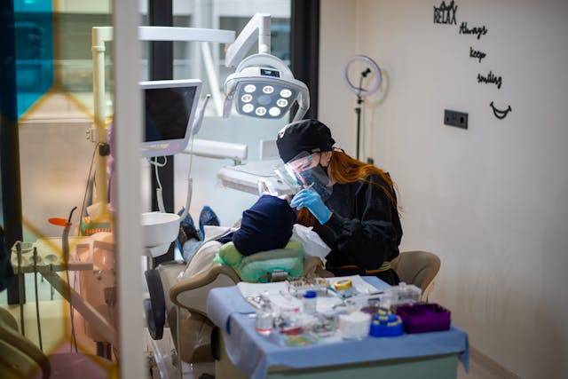 A dental specialist working on a patient