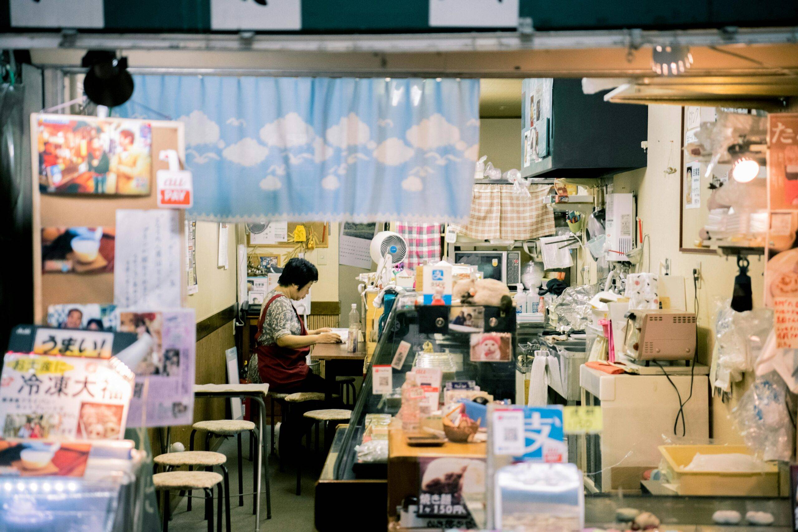 A small shop worker reviewing orders