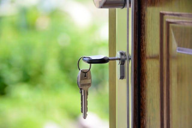 House keys inserted in a front door lock