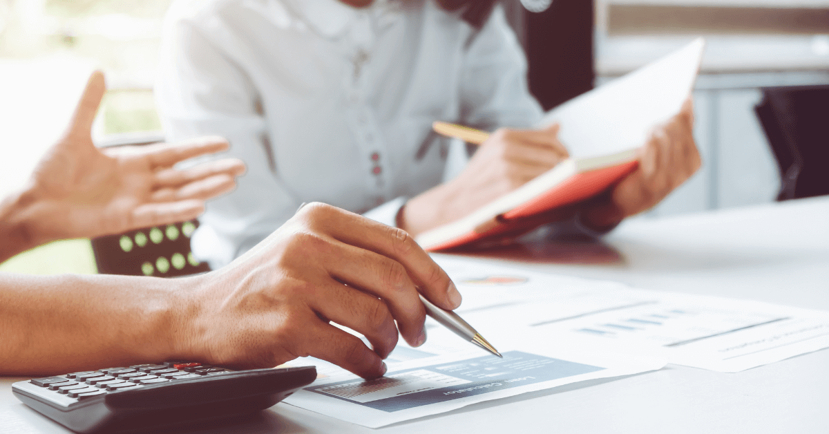 A tax preparer reviewing paperwork for tax audit services