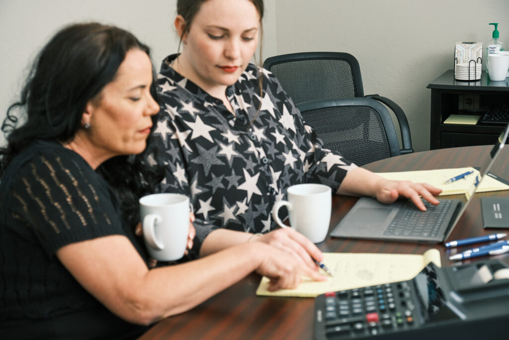CFO discussing federal corporate tax filing with accountant